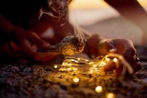 Hands, meditation with zen and burning sage for cleanse, spiritual and light for healing and balanc